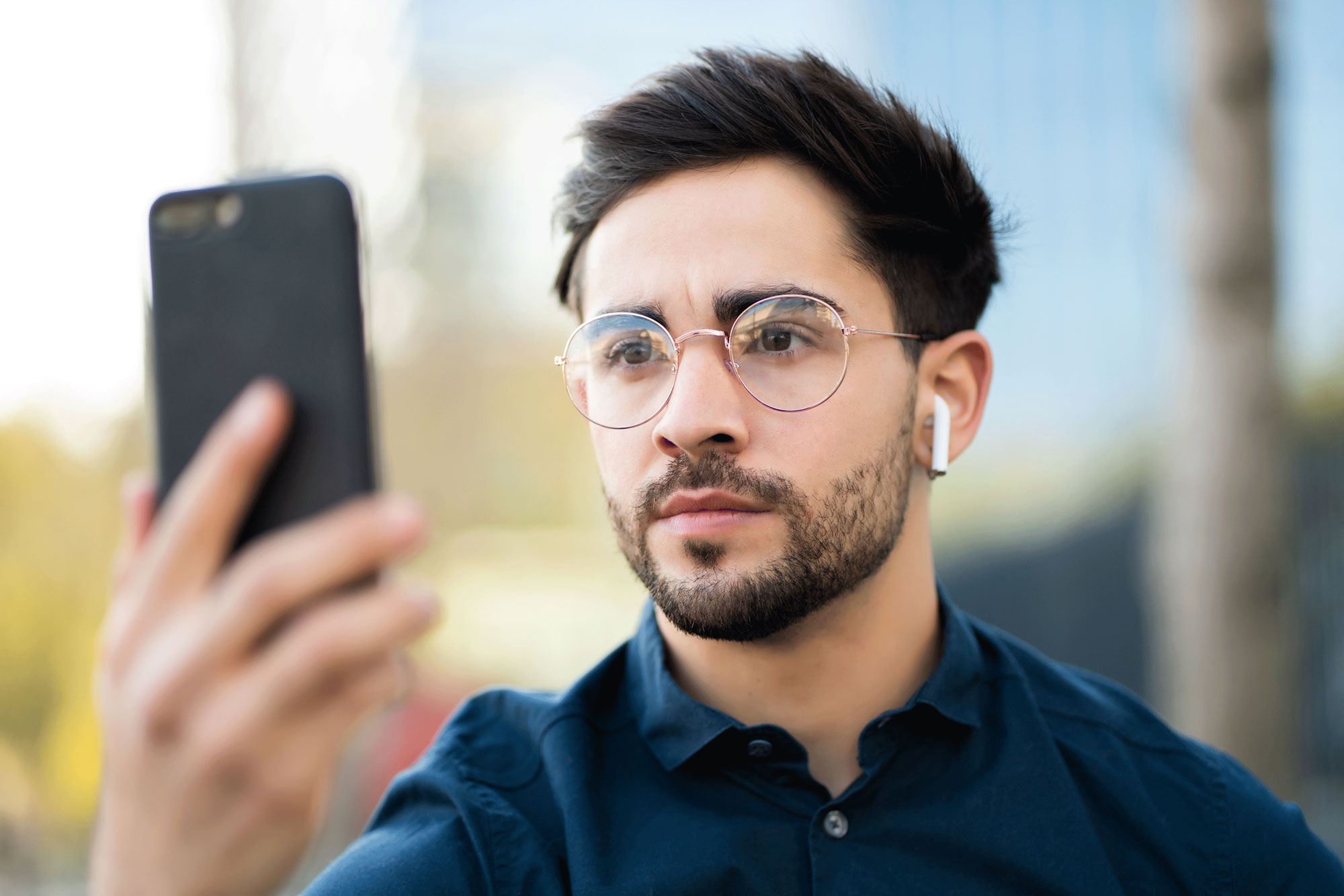 Young man using face ID for unlock mobile phone